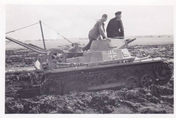A Pz Kw I mit Abwurfvorrichtung (according to the source) of the 9. Pz negotiating the mud ..............................