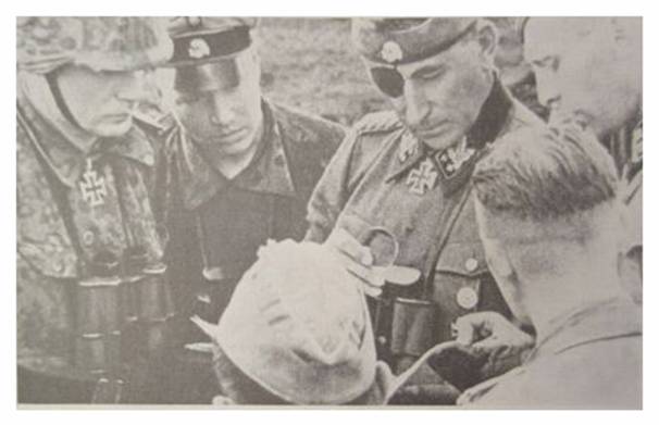 Heinz Harmel, wearing his Knight's Cross, with SS-Obergruppenführer Hauser...............