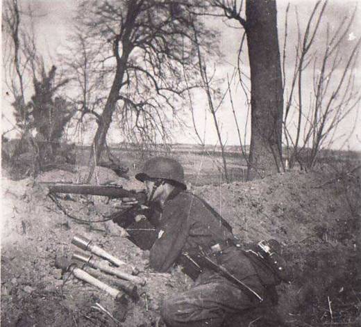 A German soldier was ready to repel the enemy assault in his defensive position.