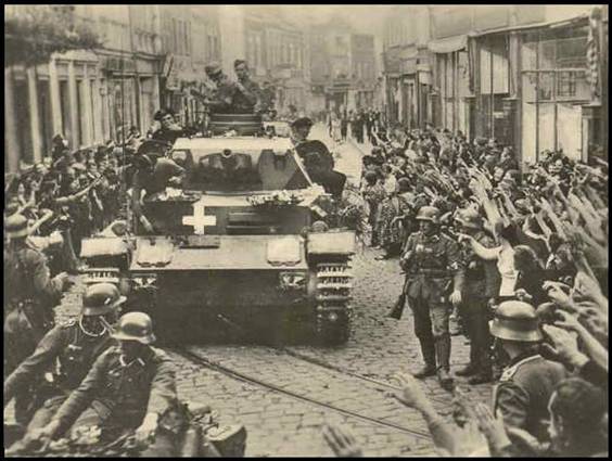 Pz Kw IV of I./PR 10 (Zinten) rolling down by a street of Graudenz while being greeted with joy by its inhabitants - Sep 1939.