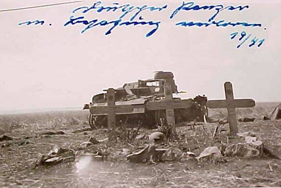A destroyed German tank and the graves of its crew - Russia 1941.
