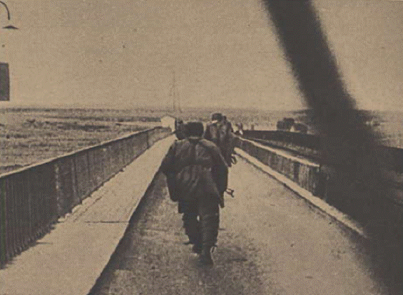 The parachutists rushing onto bridge.