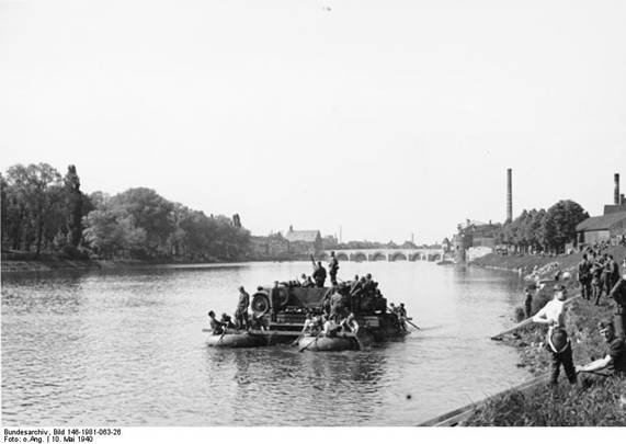 Across the Meuse; the light vehicles were shifted in ferries...........
