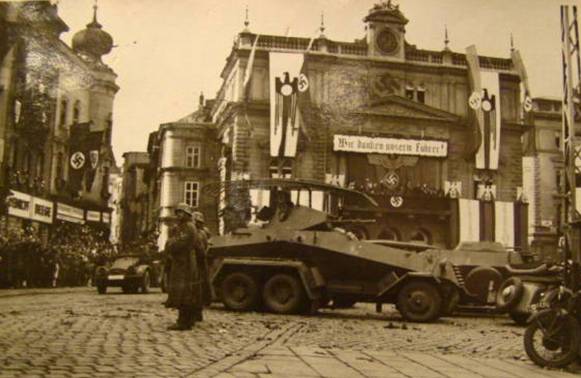 In the background stands a SdKfz.232 (Fu) - Signal light armored vehicle...............