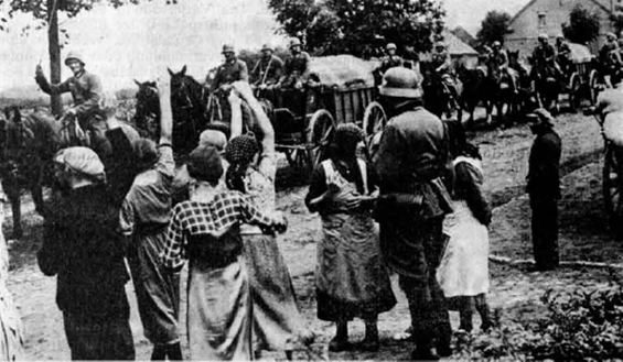 A German horse-drawn column is greeted by the local population while running through the Polish Corridor....................