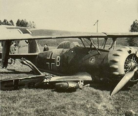 A Hs-123 with its destroyed landing gear on the airfield of Cambrai - France 1940.