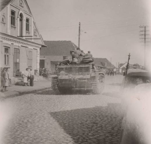 German tank moves through a street of  one Ukrainian town..........................