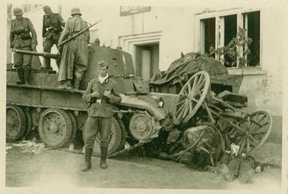 A knocked out BT-7, alongside a destroyed cart with the corpses of the coachman and the horse............