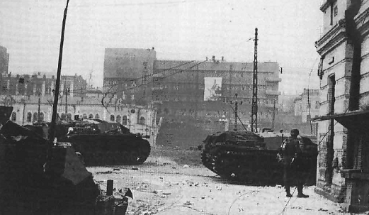 Stug III supporting the infantry of the 57 ID at the eastern end of Sverdlov street, before them the bridge over the Lopany has been blown.