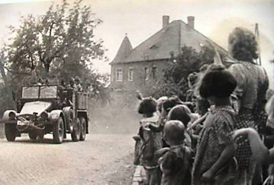 Vehicle of 1 ton Kfz 69 of the 19. Pz moving through a town during its march to the border......................