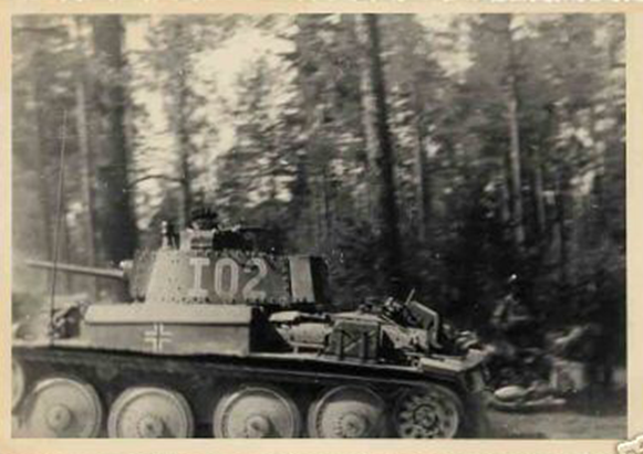 A Pz Kw 38 (t) of the PR 27 in advance through a wooded ground ......................