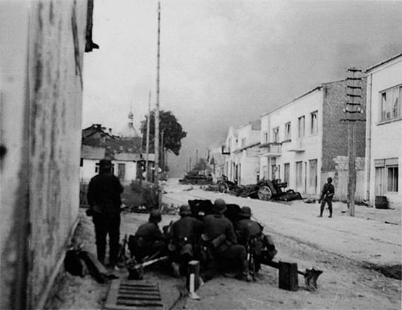 Fighting in the streets of Niemirow, in the background the guns of the 13. / IR 211 destroyed by Soviet tanks and far behind a BT-7  the 8th Tank  Div. (as per the source) .......... ............<br /> http://waralbum.ru/4906/