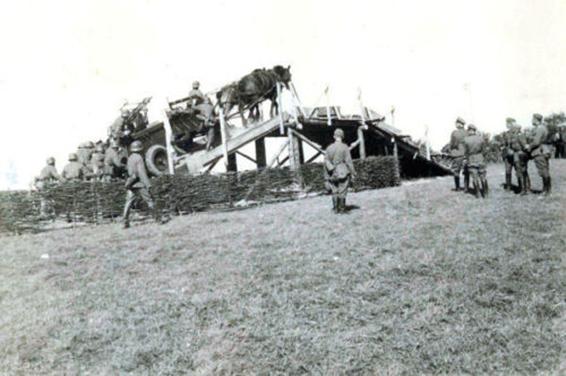 A If. 5 horse-drawn wagon (Type 36) with Zwillingslafette 36 climbing a ramp....................