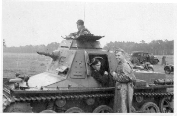A Panzerbefehlswagen I Ausf. B (265 Sd.Kfz.) With retractable antenna; apparently in an assembly area.........................