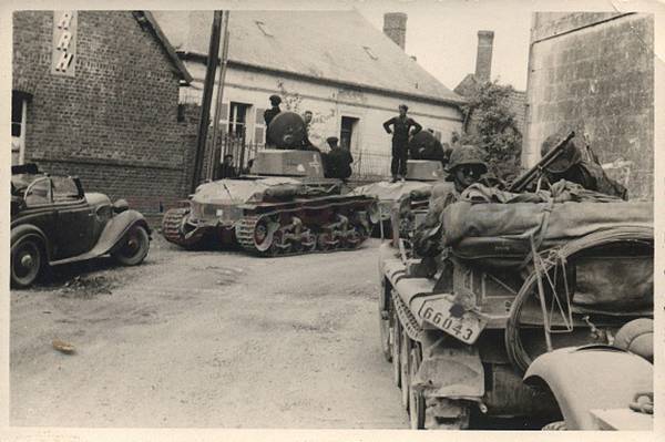 In the background a column of Pz Kw 35 (t) of the 6. Pz Div and in the foreground some Sd Kfz 10 of the SS (allegedly the SS Totenkopf)...............................