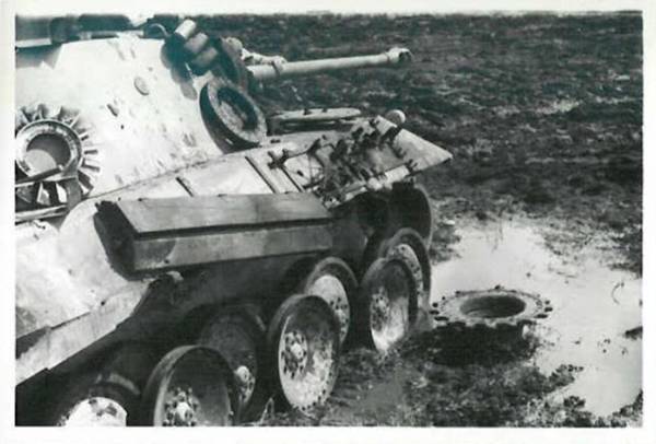 A Pz Kw V with problems in its running gear; box tools on the side of the tank ...........................