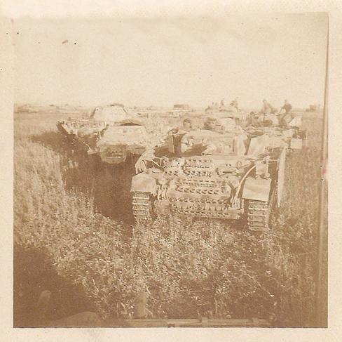 A mixed armored column of the GD Pz Brig. In the picture some Pz Kw III and a Pz Kw V &quot;Panther&quot; among others vehicles...................