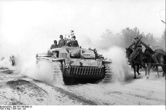 The Stug III Ausf. B No. 23 of Stug. Abt. 192 leads the way along a sandy path .................................. '