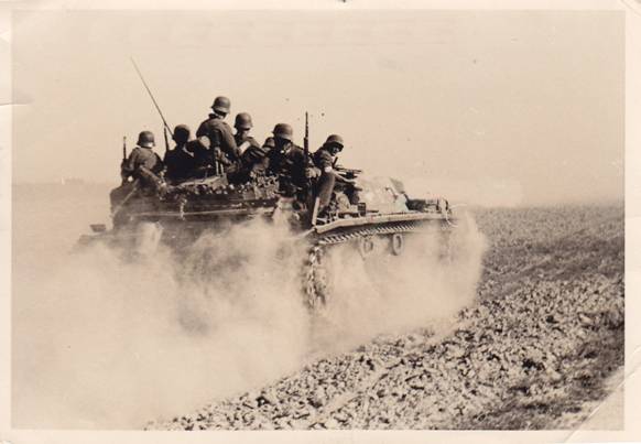 A Stug III No. 32, carrying infantry, running at high speed toward the front ...........................................................