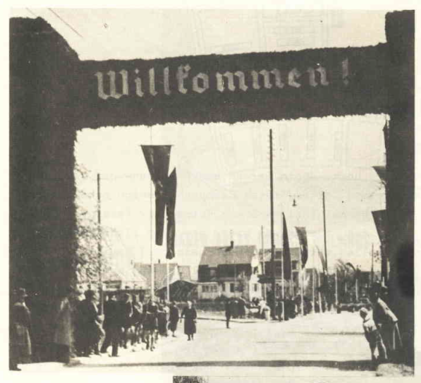 Inhabitants of Vaihingen await the approaching tanks on the main street - May 07, 1938 ............................