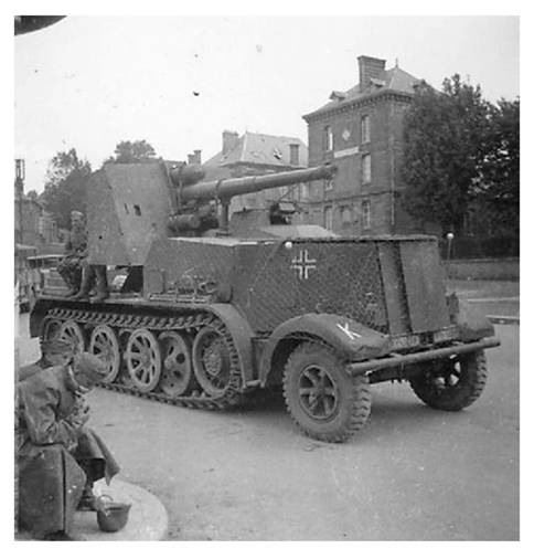 An 8.8 cm Flak 18 (Sfl) auf Zukraftwagen 12t (Sd.Kfz 8) in a French town in 1940 ..........................................
