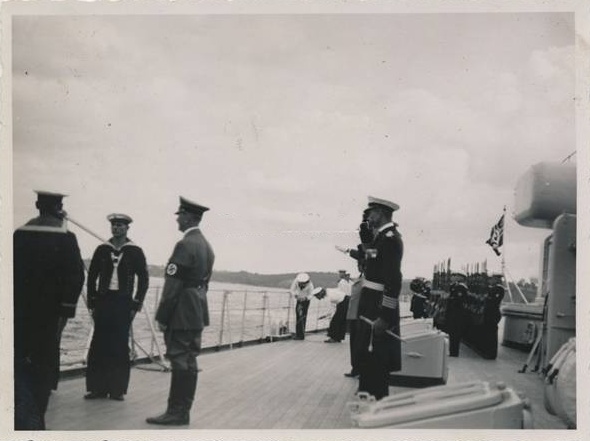 Adolf Hitler is awaiting the arrival of the Hungarian admiral Miklos Horthy on the battlecruiser Gneisenau.  Photo was taken during the Flottenparade in Kiel on August 22nd, 1938, on the occasion of the launching of the cruiser Prinz Eugen.........................