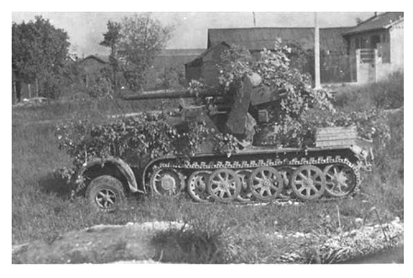 An 8.8 cm Bunkerknacker Flak 18 (Sfl) auf Zukraftwagen 12t (Sd.Kfz 8) camouflaged in a waiting position ..........................................