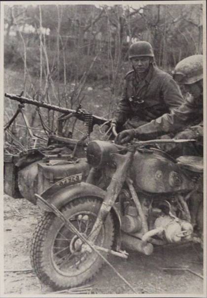 A German motorcycle BMW R 75 with sidecar (which carries a MG-34)..............................................