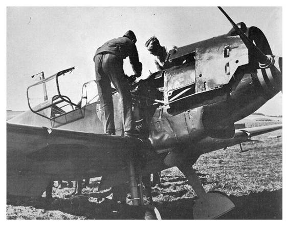 Ground crew working on the Bf-109 D-1 belonging to the Staffelkapitän of the 3. / JG 21...........................