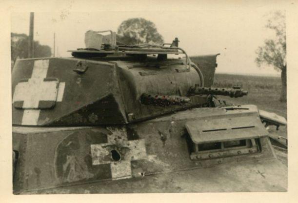 Close view of a Pz Kw I where the impact on the white cross painted on its front is clearly observed.........