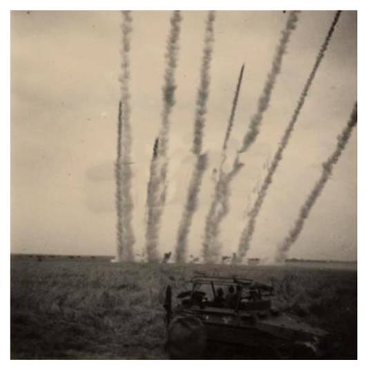 A battery of rocket launchers on fire mission: in the foreground a Sd Kfz 251/3 (mit funkanlage) of the 11. Pz......................