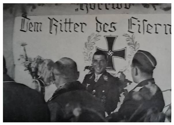 Werner Mölders celebrating his Knight's Cross (RK), shortly after he would be shot down and captured....................