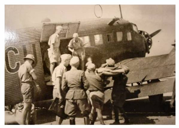 Wounded / sick DAK personnel are loaded aboard a Ju-52 for evacuation to the European continent.............................