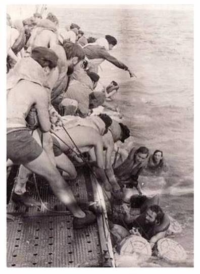 The crew of U 172 help their comrades from U 604 to get on board.................................