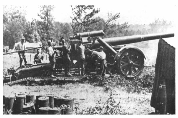 A shell being loaded into a 21 cm Mörser 18..........................