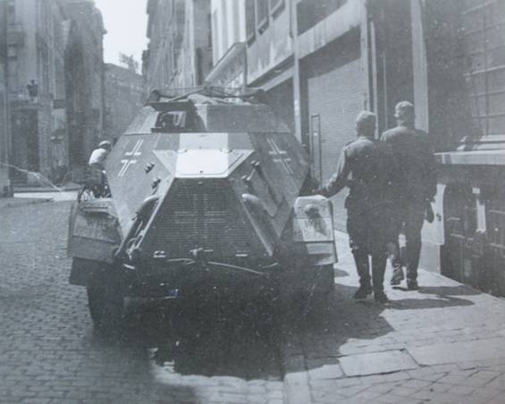 A light armored car panzerspähwagen Sd Kfz 222 (4x4) parked in a french city.