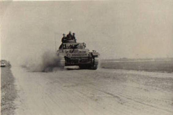 Pz Kw III rolling over a dusty Russian road at the beginning of Bararossa - Jul 1941.