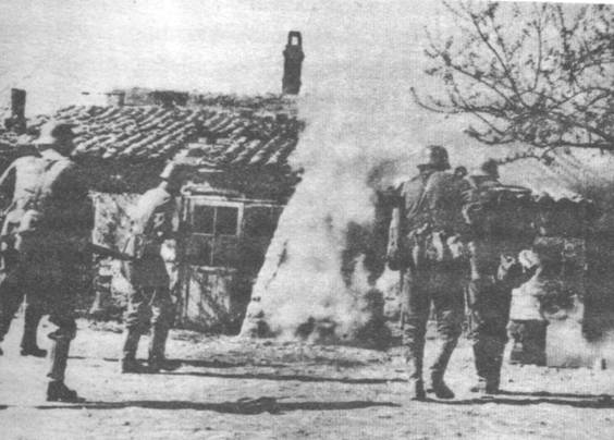 A German patrol was carefully approaching to check the house - Russia, sumer 1941.