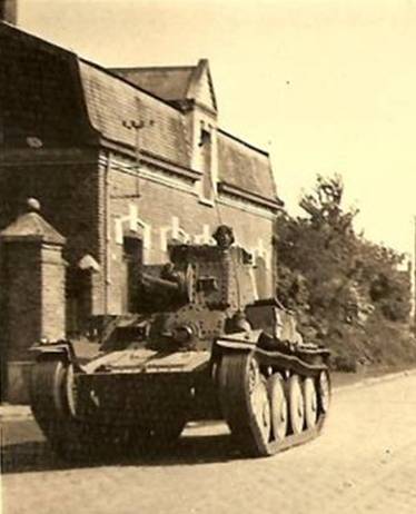 A Pz Kw 38 (t) of the PR 25 (7 Pz) rolling through a french village – May 1940.