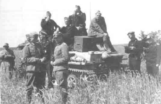 A command tank Pz Kw I; on top of it in uniform feldgrau the soon the Major and winner of the Knight’s Cross Hans Sandrock.