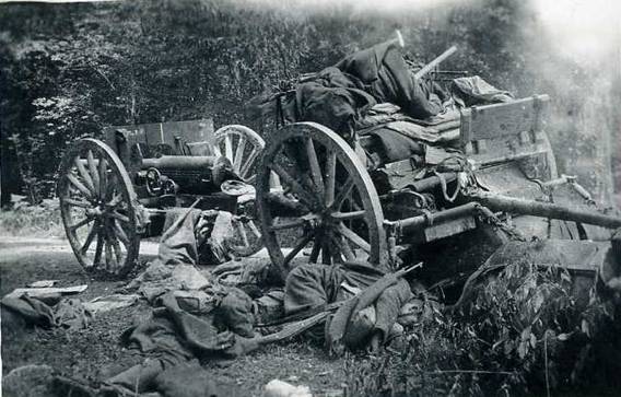 The crew of a french horse-drawn cannon, lie dead beside  the gun.....