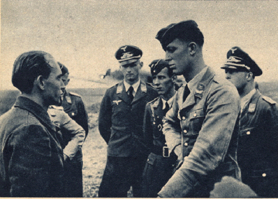 Gefr. Rohr reporting to his Staffelkapitän after returning after the crash landing due to enemy fire.