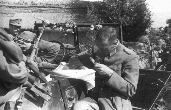 Studying the map during a break in the march - September, 1939.