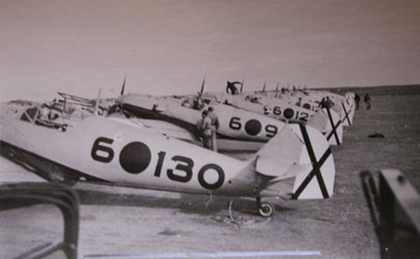 View of several Bf-109E, in foreground 6-130 and in the background the 6-12? with the top hat, the squadron's hallmark..................