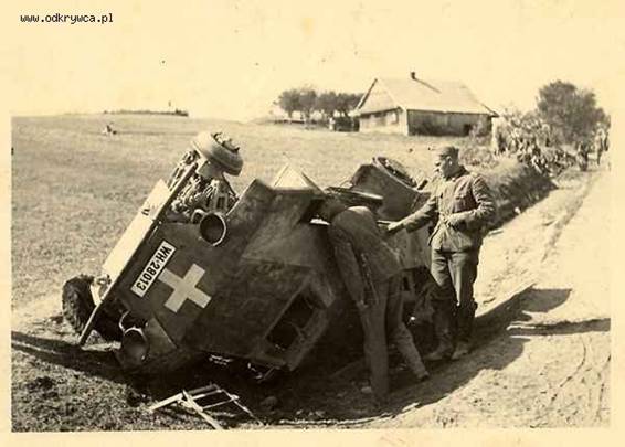 A light recce vehicle Sd Kfz 221 lies on one of its sides in a Polish road ............ <br />http://odkrywca.pl/forum_pics/picsforum22/wrak_copy10.jpg