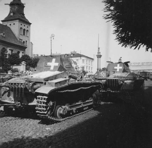Two light tanks in a Polish town, in the foreground a Pz Kw IIa / b .................