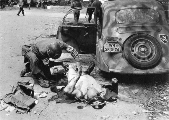 US Medic helping a German wounded........................