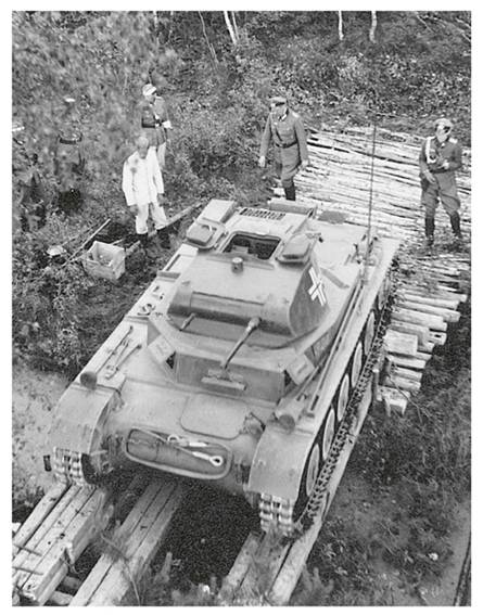 A Pz Kw II Ausf. A/B/C (Sd Kfz 121), seen from above while it negotiates a small ditch through a makeshift bridge......................