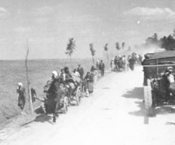Civilians flee from Bilgoraj, to the right a column of the II. / AR 63 ...................
