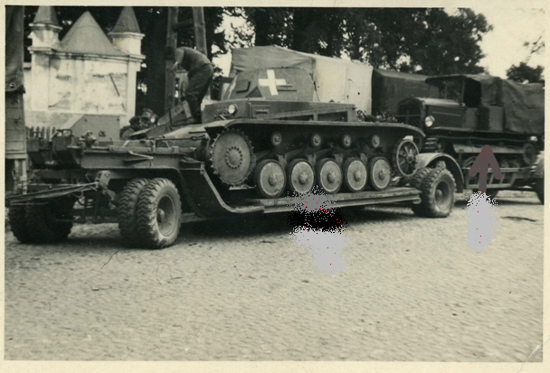 Here an Sd. Ah. 115 (Sonder Anhänger- special trailer) in Poland 1939 carrying a Pz Kw II .............................<br />HAMMER Polen Polska Panzer II Tank Anhänger Tieflader (!!) Beute Traktor Foto. eBay Auction.